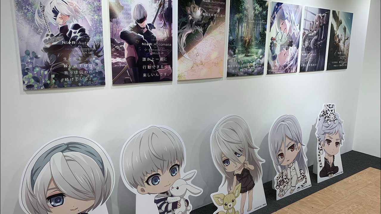 「NieR:Automata Ver1.1a POP UP STORE」ニーア オートマタ リラックス2B&9S描き下ろしイラスト キャラクターパネル 場面写真パネル グッズ展示